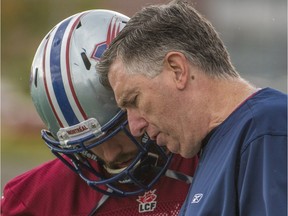 Alouettes linebackers coach Greg Quick goes over a play during 2014 season. Quick returns to the Alouettes after spending 2015 season as the Saskatchewan Roughriders defensive coordinator.