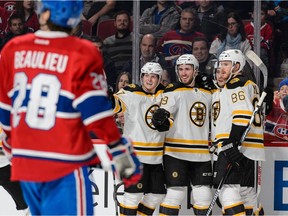 The Boston Bruins' Landon Ferraro (No. 29) celebrates with teammates after scoring goal during 3-1 win over the Canadiens on Dec. 9 at the Bell Centre in Montreal