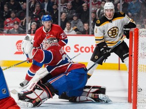 Mike Condon of the Montreal Canadiens gloves the puck during the NHL game against the Boston Bruins at the Bell Centre on December 9.