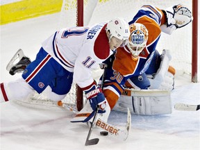 Montreal Canadiens Brendan Gallagher (11) is stopped by Edmonton Oilers goalie Ben Scrivens (30) during third period NHL hockey action in Edmonton, Alta., on Monday October 27, 2014.