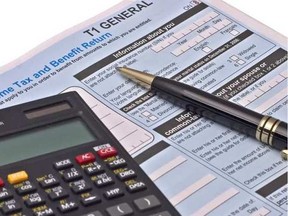 canadian-tax-forms-with-calculator-and-pen-isolated-on-white