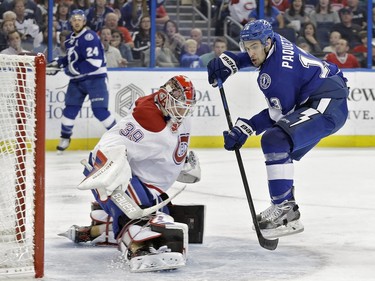 Tampa Bay Lightning center Cedric Paquette (13) watches his shot get stopped by Montreal Canadiens goalie Mike Condon (39) during the second period of an NHL hockey game Monday, Dec. 28, 2015, in Tampa, Fla.