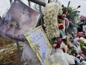 A makeshift memorial of toys and flowers sits outside the investigation area in the murder case of Cédrika Provencher on Thursday, Dec. 17, 2015, in St-Maurice.