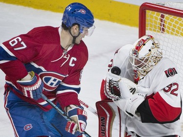 Montreal Canadiens' captain Max Pacioretty moves in on Ottawa Senators' goalie Chris Driedger during second period NHL hockey action, in Montreal, on Saturday, Dec. 12, 2015.