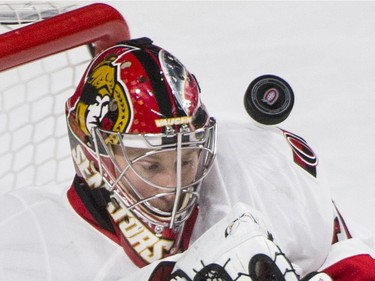 Ottawa Senators' goaltender Craig Anderson makes a save against the Montreal Canadiens during first period NHL hockey action, in Montreal, on Saturday, Dec. 12, 2015.