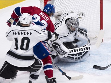 Montreal Canadiens' Dale Weise (22) takes a shot at Los Angeles Kings' goalie Jonathan Quick as he is covered by defenceman Christian Ehrhoff (10) during first period NHL hockey action, in Montreal, on Thursday, Dec. 17, 2015.