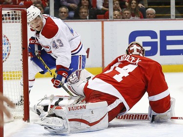 Detroit Red Wings goalie Petr Mrazek (34) stops a shot by Montreal Canadiens left wing Daniel Carr (43) in the first period of an NHL hockey game Thursday, Dec. 10, 2015 in Detroit.