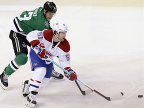 Canadiens'  David Desharnais  skates with the puck past Dallas Stars' Ales Hemsky  during the first period of an NHL hockey game Saturday, Dec. 19, 2015, in Dallas.