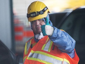 Mayor Denis Coderre gives a thumbs up after inspecting a sewage collector, Nov. 12, 2015 in Montreal.