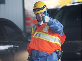 Mayor Denis Coderre gives a thumbs up after inspecting a sewage collector, Thursday, Nov. 12, 2015 in Montreal. The city was in the process of dumping raw sewage into the St. Lawrence River while repairs were being made to the sewage collectors.