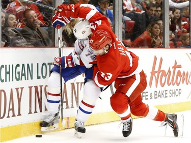 Detroit Red Wings centre Darren Helm (43) battles with Montreal Canadiens defenceman Alexei Emelin (74) for the puck in the second period of an NHL hockey game Thursday, Dec. 10, 2015 in Detroit.