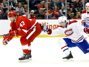 Detroit Red Wings centre Darren Helm (43) sets the puck down before scoring a goal against the Montreal Canadiens in the second period of an NHL hockey game Thursday, Dec. 10, 2015 in Detroit.