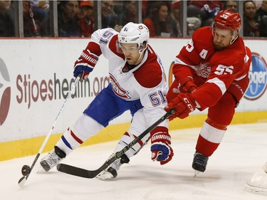 Detroit Red Wings defenceman Niklas Kronwall (55) defends Montreal Canadiens centre David Desharnais (51) in the first period of an NHL hockey game Thursday, Dec. 10, 2015 in Detroit.