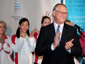 Gerald Tremblay with members of the Canadian synchronized swim team after FINA returned the world aquatics championships to Montreal.