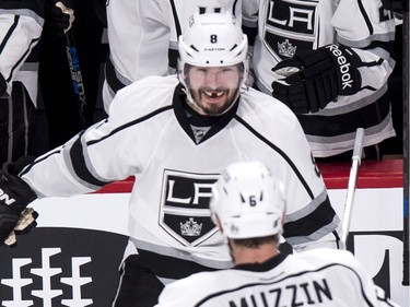 Los Angeles Kings' Drew Doughty (8) celebrates his goal against the Montreal Canadiens with teammate Jake Muzzin (6) during second period NHL hockey action, in Montreal, on Thursday, Dec. 17, 2015.