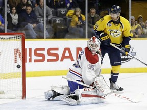 Canadiens goalie Dustin Tokarski reacts to a goal by Predators defenceman Roman Josi as James Neal looks on during the second period on Monday, Dec. 21, 2015, in Nashville, Tenn.