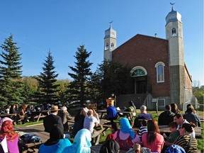 Guests in attendance to celebrate the 75th Anniversary of the Al-Rashid Mosque, built in 1938 and finally moved to Fort Edmonton Park in Edmonton, September 19, 2013. This was organized by the Edmonton Chapter of the Canadian Council of Muslim Women.