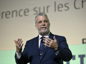 Prime Minister of Quebec Philippe Couillard delivers a speech during the opening of "Action Day" at the COP21 United Nations conference on climate change in Le Bourget on December 5, 2015.