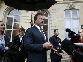 Former California governor Arnold Schwarzenegger makes a statement  after a meeting with French Prime minister on December 8, 2015 at the Matignon hotel in Paris.