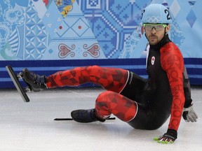 François Hamelin crashes out in a men's 5000m short-track speedskating relay semifinal at the Iceberg Skating Palace during the 2014 Winter Olympics, Thursday, Feb. 13, 2014, in Sochi, Russia. Hamelin will soon he reunited with his skates back after accidentally leaving them on a plane in Toronto.