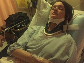 Katie Nelson, 23, says she was taken to a hospital by ambulance after having been shoved from behind by someone she believes was an undercover police officer who was dressed to blend in with about 100 anti-austerity protesters who took part in a demonstration in downtown Montreal on Friday, Dec. 18, 2015.
