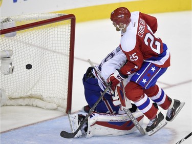 Washington Capitals left wing Jason Chimera (25) scores a goal against Montreal Canadiens goalie Mike Condon (39) during the third period of an NHL hockey game, Saturday, Dec. 26, 2015, in Washington. The Capitals won 3-1.