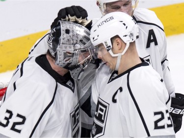 Los Angeles Kings' goalie Jonathan Quick is congratulated by captain Dustin Brown (23) after shutting out the Montreal Canadiens 3-0 during NHL hockey action, in Montreal, on Thursday, Dec. 17, 2015.