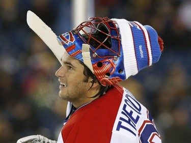 Former Montreal Canadiens' Jose Theodore wears hat on his goalie mask during an Alumni outdoor hockey game against former Boston Bruins players at Gillette Stadium in Foxborough, Mass., Thursday, Dec. 31, 2015, where the Bruins will play the Canadiens in the NHL Winter Classic on Friday.