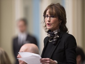 Quebec Immigration, Diversity and Inclusiveness Minister Kathleen Weil tables an update to Quebec's immigration law on Wednesday, Dec. 2, 2015 at the legislature in Quebec City.