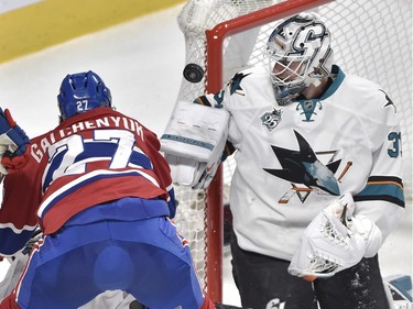 San Jose Sharks' goalie Martin Jones (31) makes a save on Montreal Canadiens' centre Alex Galchenyuk (27) during third period NHL hockey action, in Montreal, on Tuesday, Dec. 15, 2015.