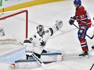 San Jose Sharks' goalie Martin Jones (31) makes a save in front of Montreal Canadiens' left wing Max Pacioretty (67) during third period NHL hockey action, in Montreal, on Tuesday, Dec. 15, 2015.