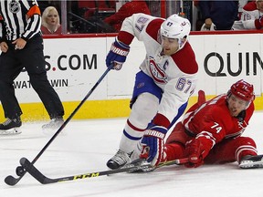 Canadiens' Max Pacioretty tangles with Carolina Hurricanes' Jaccob Slavin during the second period of an NHL hockey game Saturday, Dec. 5, 2015, in Raleigh, N.C.