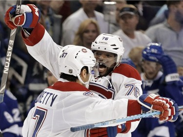 Montreal Canadiens left wing Max Pacioretty (67) celebrates with P.K. Subban (76) after Pacioretty scored in a shootout against the Tampa Bay Lightning during an NHL hockey game Monday, Dec. 28, 2015, in Tampa, Fla. The Canadiens won 4-3.