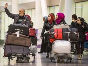 Mazen Khabbaz  and his family are one of two Syrian refugee families that  arrived in Toronto Pearson International Airport in Mississauga, Ont.  on Wednesday December 9, 2015.