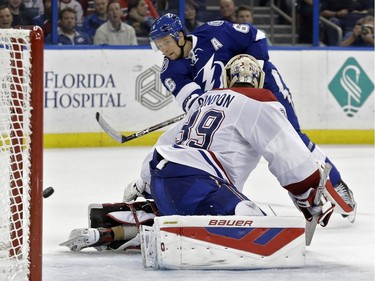 Tampa Bay Lightning defenseman Anton Stralman (6), of Sweden, shoots the puck wide of Montreal Canadiens goalie Mike Condon (39) and the net during the second period of an NHL hockey game Monday, Dec. 28, 2015, in Tampa, Fla.