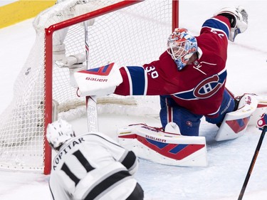 Los Angeles Kings' Anze Kopitar (11) scores past Montreal Canadiens' goalie Mike Condon during second period NHL hockey action, in Montreal, on Thursday, Dec. 17, 2015.