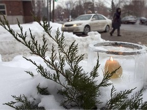 A candle sits at the of an scene at site of an accident where  Jessica Lauren Holman-Price  was killed by a snow truck in 2005 at the corner of Strathcona Ave. and Sherbrooke St. W. in Westmount.
