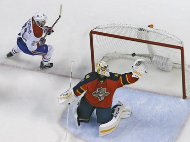 Alex Galchenyuk #27 of the Montreal Canadiens circles the net as Goaltender Roberto Luongo #1 of the Florida Panthers makes a glove save during third period action at the BB&T Center on December 29, 2015 in Sunrise, Florida. The Panthers defeated the Canadiens 3-1.