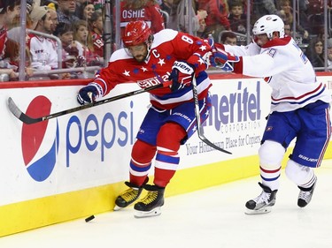 Andrei Markov #79 of the Montreal Canadiens hits Alex Ovechkin #8 of the Washington Capitals into the boards during the second period at Verizon Center on December 26, 2015 in Washington, DC.