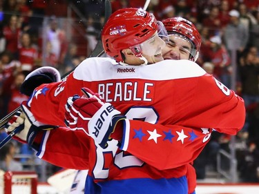 Tom Wilson #43 of the Washington Capitals congratulates Jay Beagle #83 after he scored against the Montreal Canadiens during the second period at Verizon Center on December 26, 2015 in Washington, DC.