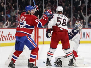 Montreal Canadiens Dale Weise celebrates team-mate Max Pacioretty's game-winning goal against the Columbus Blue Jackets during third period of National Hockey League game in Montreal Tuesday December 1, 2015. Blue Jackets goalie Sergei Bobrovsky and defenceman David Savard watch.