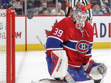 Montreal Canadiens goalie Mike Condon keeps his eyes on a rebound after making a save during second period of National Hockey League game against the Columbus Blue Jackets in Montreal Tuesday December 1, 2015.
