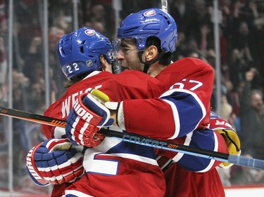 Montreal Canadiens Max Pacioretty celebrates his game-winning goal against the Columbus Blue Jackets with team-mate Dale Weise during third period of National Hockey League game in Montreal Tuesday December 1, 2015.