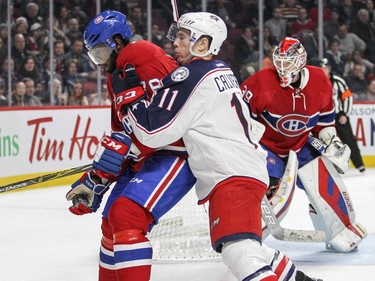 Montreal Canadiens P.K. Subban drops the puck after catching it out of the air while being pressured by Columbus Blue Jackets Matt Calvert during second period of National Hockey League game in Montreal Tuesday December 1, 2015.  Canadiens goalie Mike Condon watches from the net.