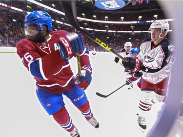 Montreal Canadiens P.K. Subban turns away from a check by Columbus Blue Jackets Alexander Wennberg during National Hockey League game in Montreal Tuesday December 1, 2015.