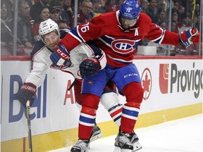 Montreal Canadiens P.K Subban checks Columbus Blue Jackets Boone Jenner during National Hockey League game in Montreal Tuesday December 1, 2015.