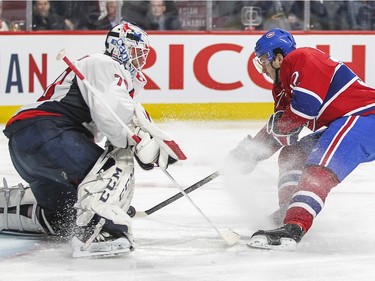 Montreal Canadiens Brian Flynn scores on Washington Capitals Braden Holtby during third period of National Hockey League game in Montreal Thursday December 3, 2015.