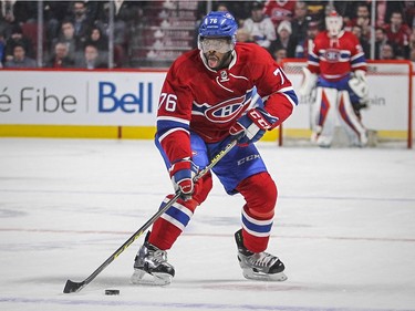 Montreal Canadiens P.K. Subban sticks his tongue out while moving the puck up-ice during National Hockey League game against the Washington Capitals in Montreal Thursday December 03, 2015.