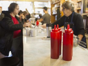 Ketchup bottles on the main counter at Moe's-Casse-Croute-du-Coin Friday, December 4, 2015.