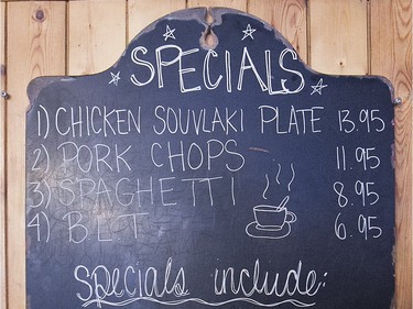 The daily special blackboard at the back of at Moe's-Casse-Croute-du-Coin Friday, December 4, 2015.